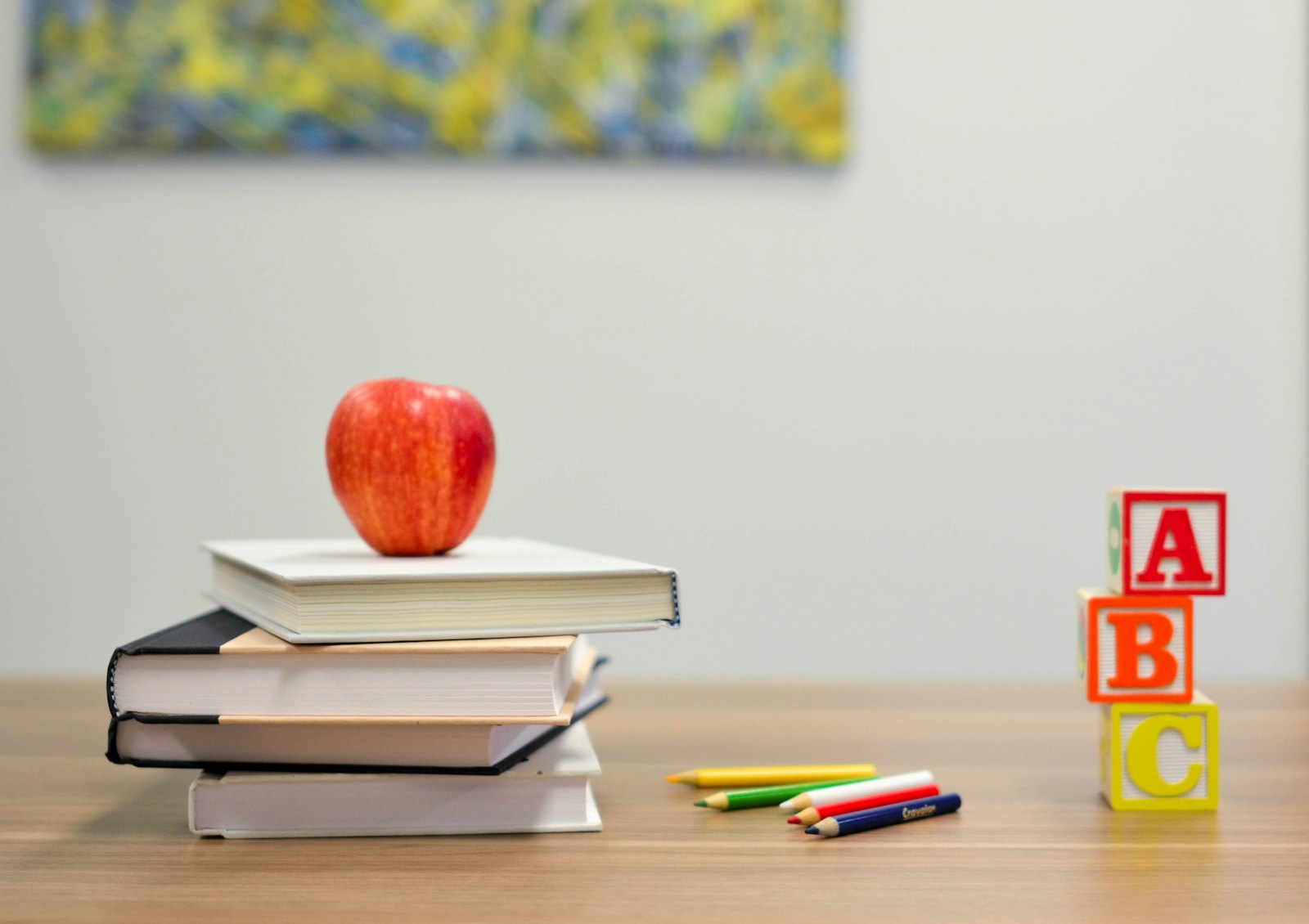 Books and school supplies on a classroom desk